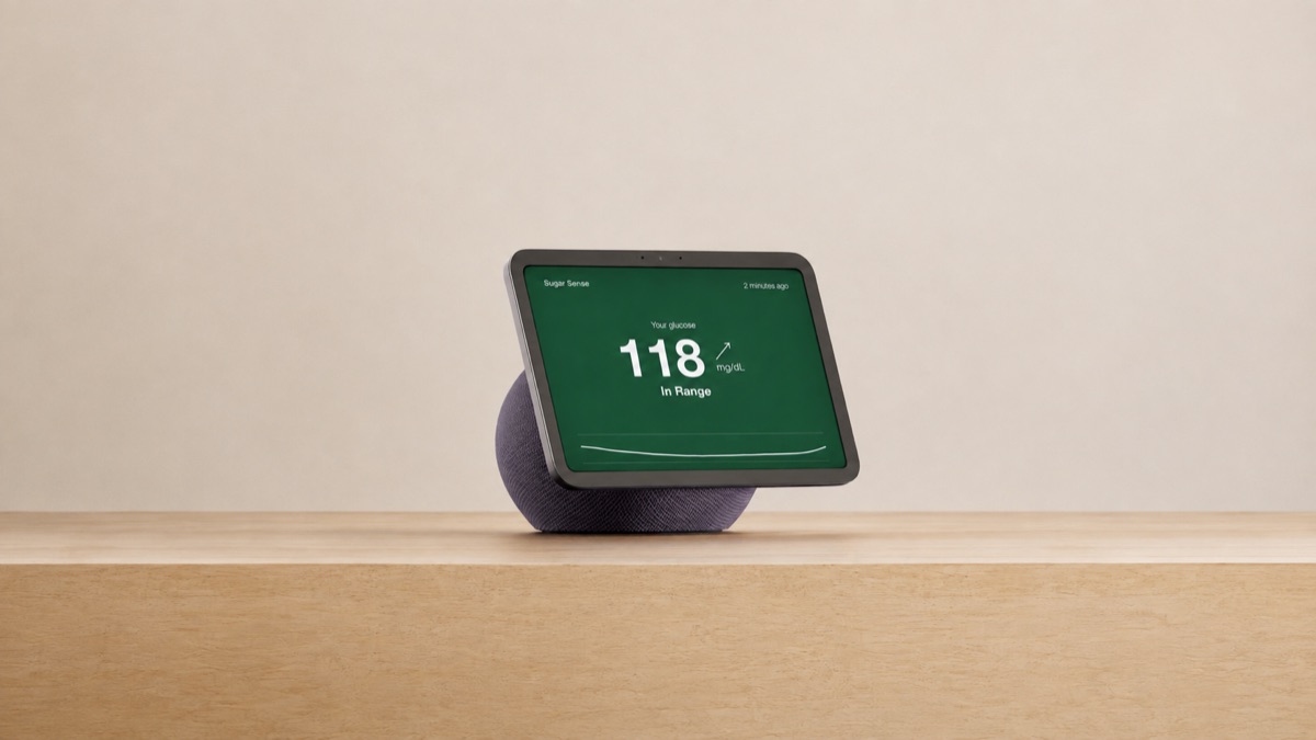 Smart display on a wooden shelf showing the Sugar Sense glucose card: 118 mg/dL, rising arrow, In Range
